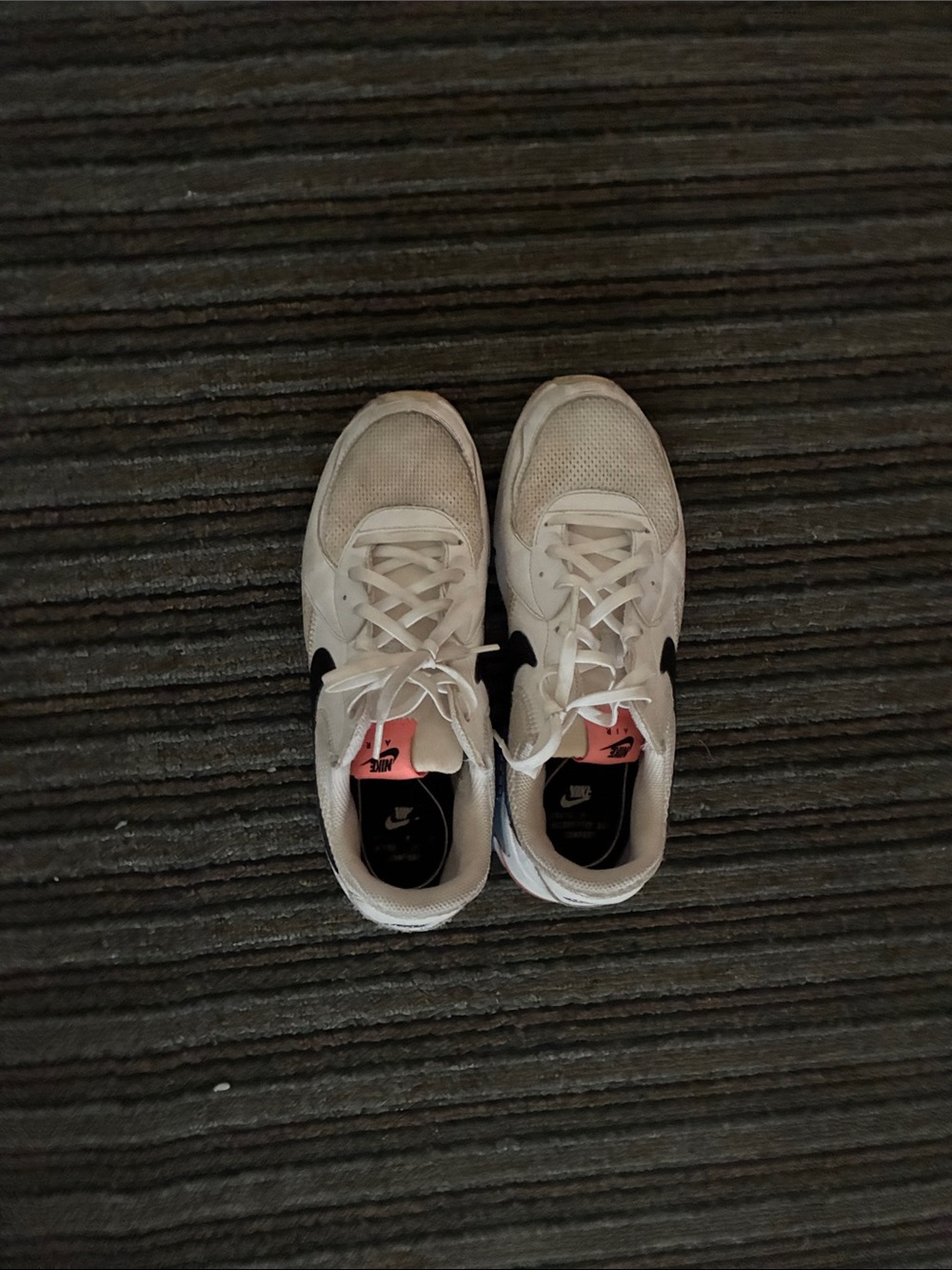 Nike Women's White Sneakers with Black Swoosh and Pink Tongue